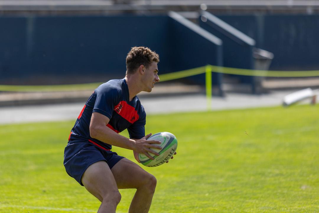 A Saint Mary's rugby player holding the ball