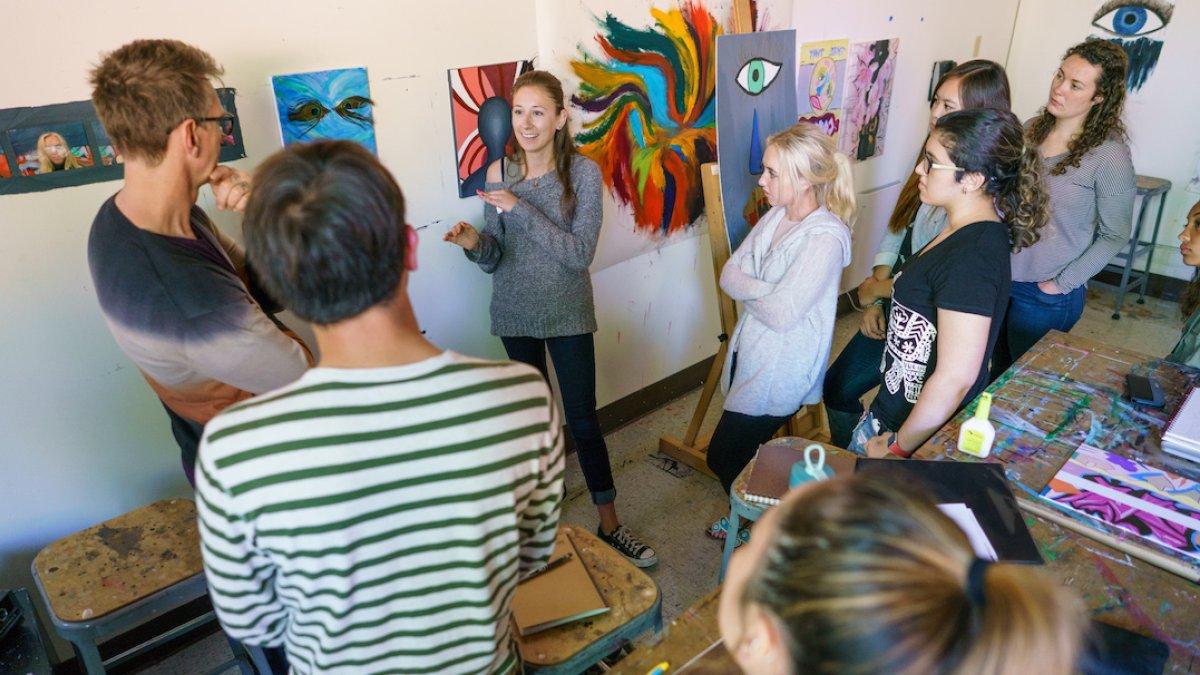 People gathering in an art exhibit